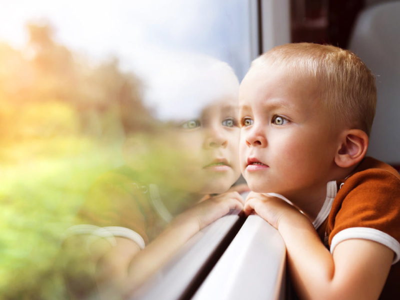 Autism - Boy Looking Through Window